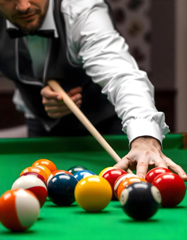 Player lining up a shot at a billiards table