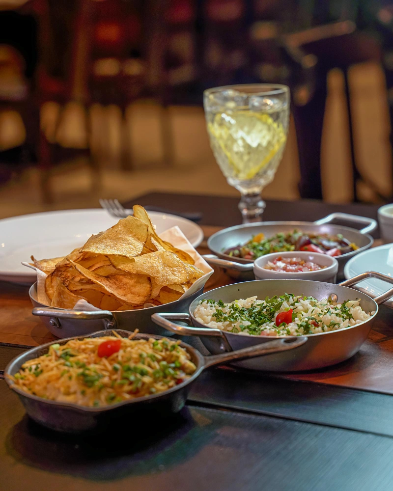 Dishes and a drink served at a dining table
